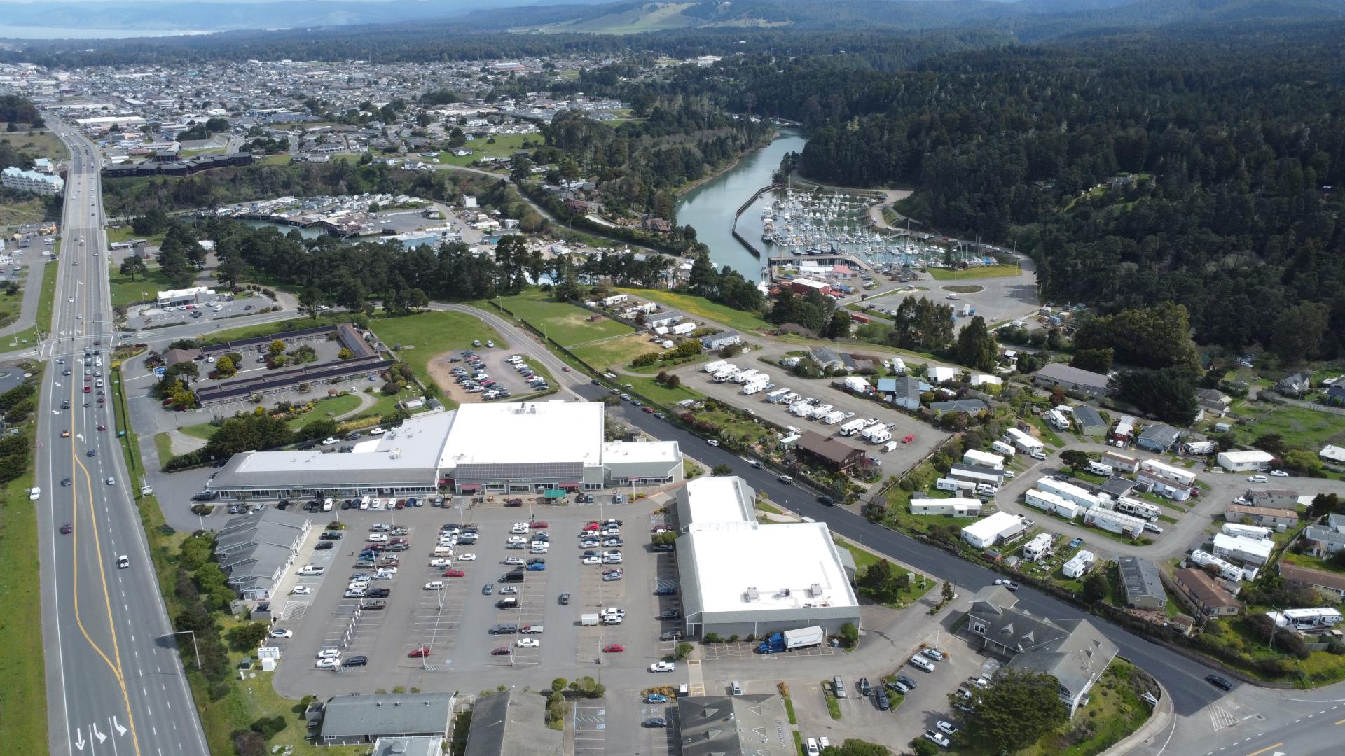 Aerial view of a parking lot adjacent to a winding river