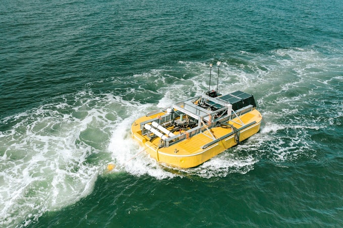 A yellow boat moves swiftly